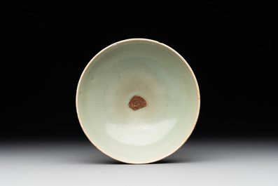 A Chinese Longquan celadon 'lotus' bowl and a large green-glazed Shiwan jar, Ming and later