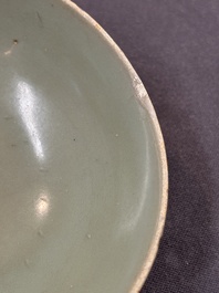 A Chinese Longquan celadon 'lotus' bowl and a large green-glazed Shiwan jar, Ming and later