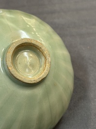 A Chinese Longquan celadon 'lotus' bowl and a large green-glazed Shiwan jar, Ming and later