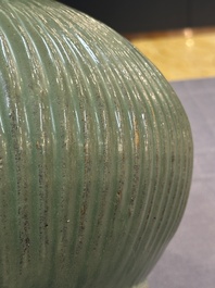 A Chinese Longquan celadon 'lotus' bowl and a large green-glazed Shiwan jar, Ming and later