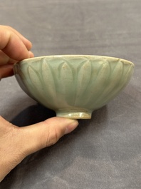 A Chinese Longquan celadon 'lotus' bowl and a large green-glazed Shiwan jar, Ming and later