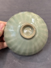 A Chinese Longquan celadon 'lotus' bowl and a large green-glazed Shiwan jar, Ming and later