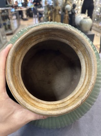 A Chinese Longquan celadon 'lotus' bowl and a large green-glazed Shiwan jar, Ming and later