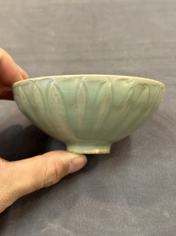 A Chinese Longquan celadon 'lotus' bowl and a large green-glazed Shiwan jar, Ming and later