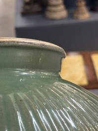 A Chinese Longquan celadon 'lotus' bowl and a large green-glazed Shiwan jar, Ming and later