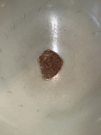 A Chinese Longquan celadon 'lotus' bowl and a large green-glazed Shiwan jar, Ming and later