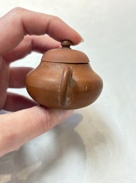 A small Chinese Yixing stoneware covered teapot and two Swatow Yixing-style covered teapots, Yixing Hui Mengchen 宜興惠孟臣製 and Shunji 順記 marks, 19/20th C.