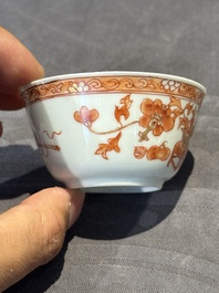 A pair of Chinese polychrome-decorated cups and saucers and an iron-red gilt-decorated cup and saucer, Yongzheng/Qianlong