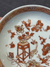 A pair of Chinese polychrome-decorated cups and saucers and an iron-red gilt-decorated cup and saucer, Yongzheng/Qianlong