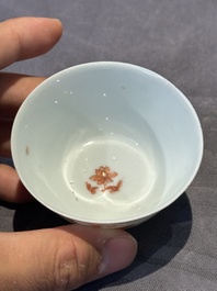 A pair of Chinese polychrome-decorated cups and saucers and an iron-red gilt-decorated cup and saucer, Yongzheng/Qianlong