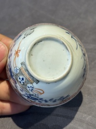 A pair of Chinese polychrome-decorated cups and saucers and an iron-red gilt-decorated cup and saucer, Yongzheng/Qianlong