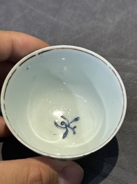 A pair of Chinese polychrome-decorated cups and saucers and an iron-red gilt-decorated cup and saucer, Yongzheng/Qianlong