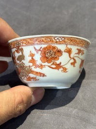 A pair of Chinese polychrome-decorated cups and saucers and an iron-red gilt-decorated cup and saucer, Yongzheng/Qianlong