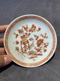 A pair of Chinese polychrome-decorated cups and saucers and an iron-red gilt-decorated cup and saucer, Yongzheng/Qianlong