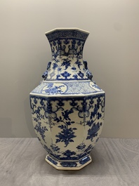 A pair of Chinese blue and white octagonal vases with floral design, 19th C.