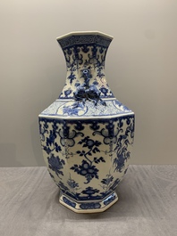 A pair of Chinese blue and white octagonal vases with floral design, 19th C.