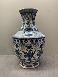 A pair of Chinese blue and white octagonal vases with floral design, 19th C.