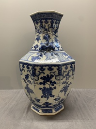 A pair of Chinese blue and white octagonal vases with floral design, 19th C.