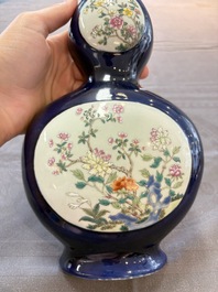 A pair of Chinese famille rose blue-ground wall pocket vases with floral design, Jing Shun Tang 經筍堂 mark, 19th C.