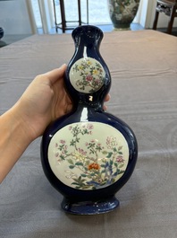 A pair of Chinese famille rose blue-ground wall pocket vases with floral design, Jing Shun Tang 經筍堂 mark, 19th C.