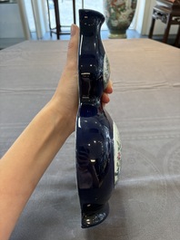 A pair of Chinese famille rose blue-ground wall pocket vases with floral design, Jing Shun Tang 經筍堂 mark, 19th C.