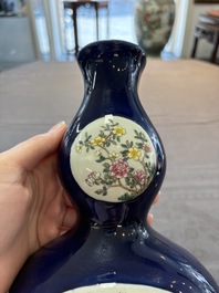 A pair of Chinese famille rose blue-ground wall pocket vases with floral design, Jing Shun Tang 經筍堂 mark, 19th C.