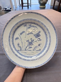 Five Chinese blue and white 'birds and flowers' and 'peony scroll' plates and dishes, 18/19th C.