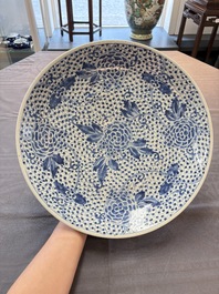 Five Chinese blue and white 'birds and flowers' and 'peony scroll' plates and dishes, 18/19th C.
