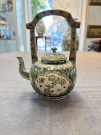 A Chinese verte biscuit teapot and cover with floral design, Kangxi