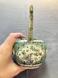 A Chinese verte biscuit teapot and cover with floral design, Kangxi