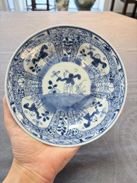 Nine Chinese blue and white plates with figural design, 18th C.
