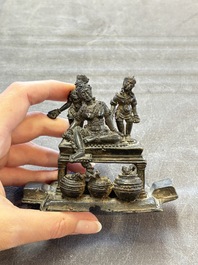 Five Chinese bronze seals and an Indonesian bronze figure group, 18/19th C.