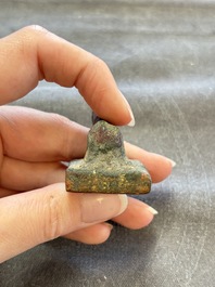 Five Chinese bronze seals and an Indonesian bronze figure group, 18/19th C.