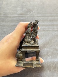 Five Chinese bronze seals and an Indonesian bronze figure group, 18/19th C.