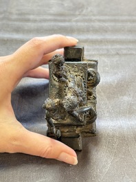 Five Chinese bronze seals and an Indonesian bronze figure group, 18/19th C.