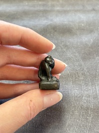 Five Chinese bronze seals and an Indonesian bronze figure group, 18/19th C.