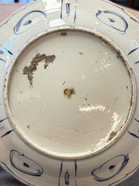 Three Chinese blue and white 'kraak' dishes with a bird and flowers, Wanli