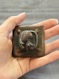 Five Chinese bronze seals and an Indonesian bronze figure group, 18/19th C.