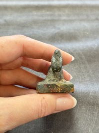 Five Chinese bronze seals and an Indonesian bronze figure group, 18/19th C.