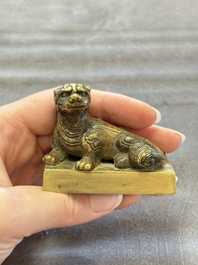 Five Chinese bronze seals and an Indonesian bronze figure group, 18/19th C.