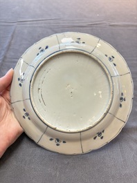 Five Chinese blue and white 'kraak' and 'kraak'-style plates, a saucer and a bowl, Ming/Qing