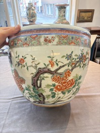 A Chinese famille rose 'mandarin ducks in a lotus pond' scroll pot, 19th C.