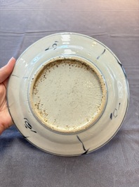 Five Chinese blue and white 'kraak' and 'kraak'-style plates, a saucer and a bowl, Ming/Qing