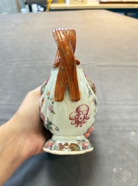 A pair of Chinese famille rose sauceboats and stands with floral design, Qianlong