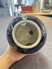 A Japanese Kutani group of a Shishi standing on an openworked brocade ball, 20th C.