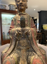 A large Chinese polychrome-lacquered and gilt bronze Daoist immortal, 17th C.