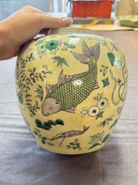 A pair of Chinese verte biscuit 'fish' jars and covers, 19th C.