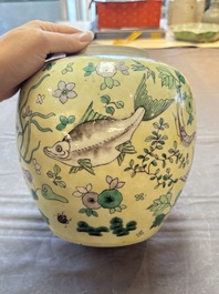 A pair of Chinese verte biscuit 'fish' jars and covers, 19th C.