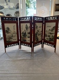 A Chinese four-fold wooden table screen with qianjian cai plaques, 20th C.