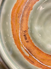 A rare and large Chinese Longquan celadon 'lotus bouquet' dish, Ming, early 15th C.